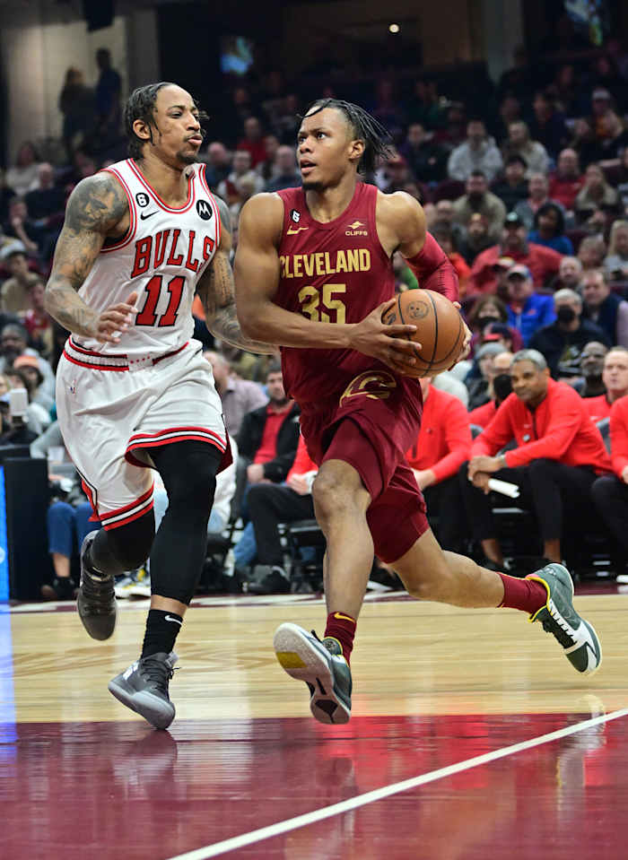 Jan 2, 2023; Cleveland, Ohio, USA; Cleveland Cavaliers forward Isaac Okoro (35) drives to the basket against Chicago Bulls forward DeMar DeRozan (11) during the first half at Rocket Mortgage FieldHouse.